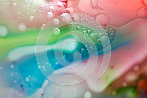 Milk, Oil and Food Colorants Mixed Together to Create an Abstract Image photo