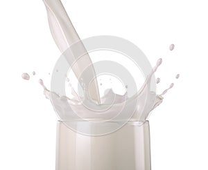 Milk pouring into a glass with splash. Close up side view