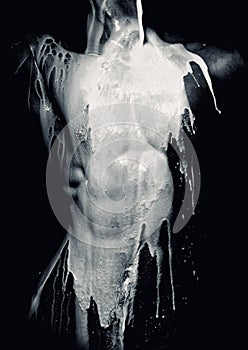 Milk pouring on male torso photo