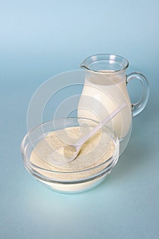 Milk powder, jug with milk