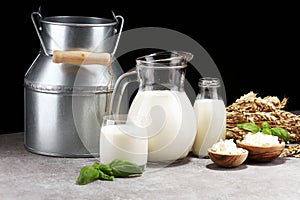 Milk products. tasty healthy dairy products on a table. sour cream in a white bowl, cottage cheese bowl, cream in a a bank and