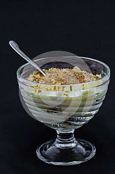 Milk pudding with vanilla ice-cream in glass dishes