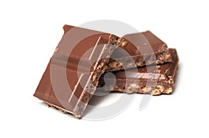 Milk puffed rice chocolate blocks on white background