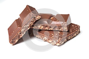 Milk puffed rice chocolate blocks on white background