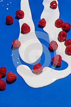 Milk and rapberries abstraction