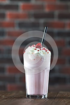 Milk shake banana and raspberries with cream