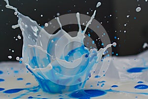 milk splash with blue food coloring