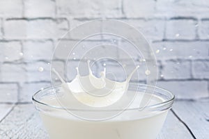 Milk splash in a glass bowl