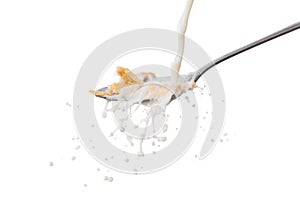 Milk splash on the spoon with cornflakes