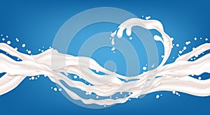 Milk splashes isolated on blue background.