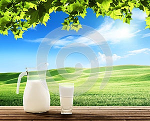 Milk and sunny spring field