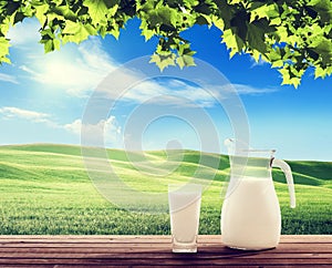 Milk and sunny spring field