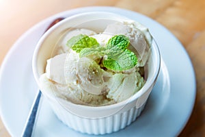 Milk vanila ice creams with mint leaf photo