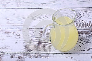 Milk whey in a glass jug