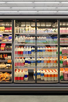 Milk, yoghurt, kefir and diary product in Glass door fridge at supermarket