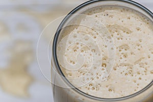 Milkshake with banana, oats and cinnamon in a glass