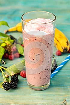 Milkshake with banana, raspberries blackberries and blackcurrants