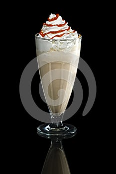 Milkshake caramel summer cocktail isolated on black