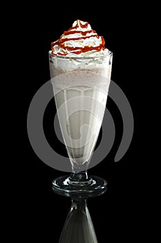 Milkshake caramel summer cocktail isolated on black