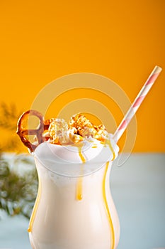 Milkshake with caramel syrup, popcorn and brezel waffles