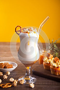 Milkshake with caramel syrup, popcorn and brezel waffles