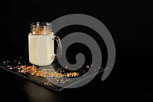 Milkshake with festive decoration on a dark background.