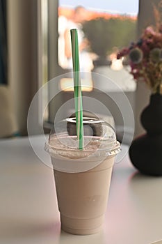 a milkshake in a glass on the table