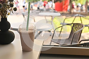 milkshake in a glass on the table in a cafe