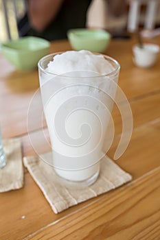 milkshake in glass on a wooden table