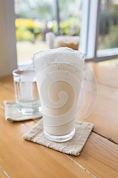 milkshake in glass on a wooden table