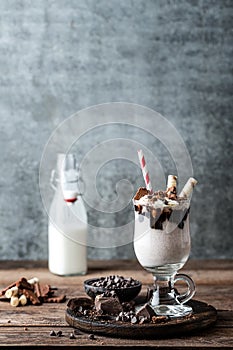 Milkshake with ice cream, chocolate and cookies