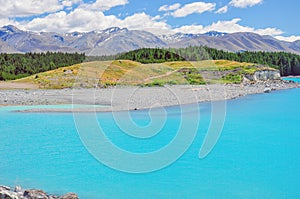 Milky blue of Lake Pukaki with beautiful view on Southern Alps in the background in South Island New Zealand