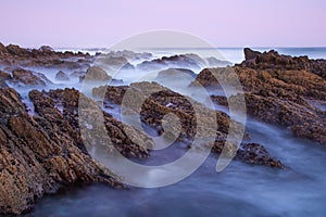 Milky Sea Water over Rocks at the Coast