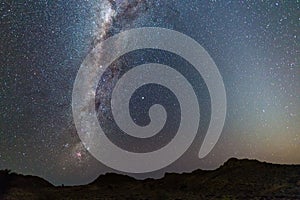 Milky Way arch, stars in the sky, the Namib desert in Namibia, Africa. The Small Magellanic Cloud on the left hand side.