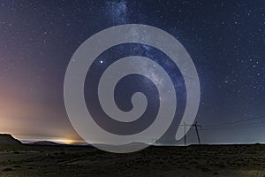 Milky way and falling meteorites in the night sky photo