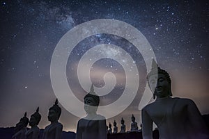 Milky way galaxy over many of buddha statues at Phu Phra Ban Mak Khaeng, Dan Sai, Loei, Thailand