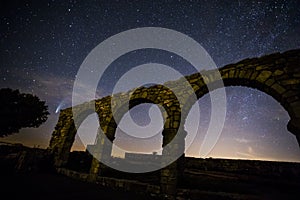 Milky way and Neowise comet in Santuari De La Mare De Deu Del Mont church, Spain