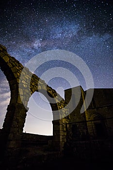 Milky way and Neowise comet in Santuari De La Mare De Deu Del Mont church, Spain