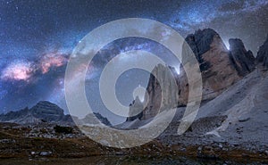 Milky Way over mountains at night in summer. Tre Cime