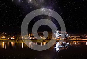 Milky way over old czech town