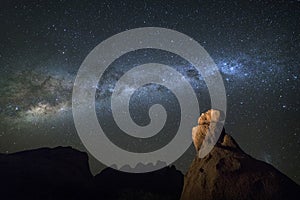 Milky way over a rock formation.