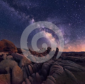 Milky Way over rocky terrain