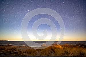 Milky way over sea at night at beach