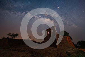 Milky Way with Phi Ta Khon rock. Galaxy, Long exposure Photograph with grain. The milky way and cross above canyon, LaLu in