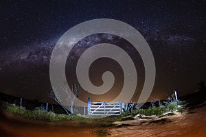 Milky Way recorded in south america in the fall - gate in the foreground.