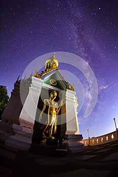 Milky Way at Standing gold Buddha image name is Wat Sra Song Pee