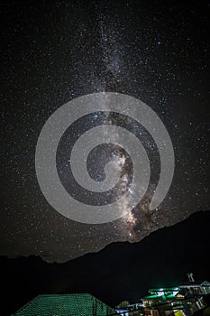 Milky way star shining above small town kaza