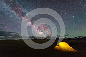 Milky Way on Starry Sky and Yellow Tent photo