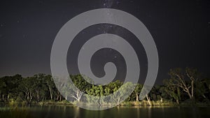 Milky-way time lapse of Murray Riverbank at night. The moon rises at the end. Outback Australia.