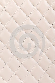 Milky white quilted leather background